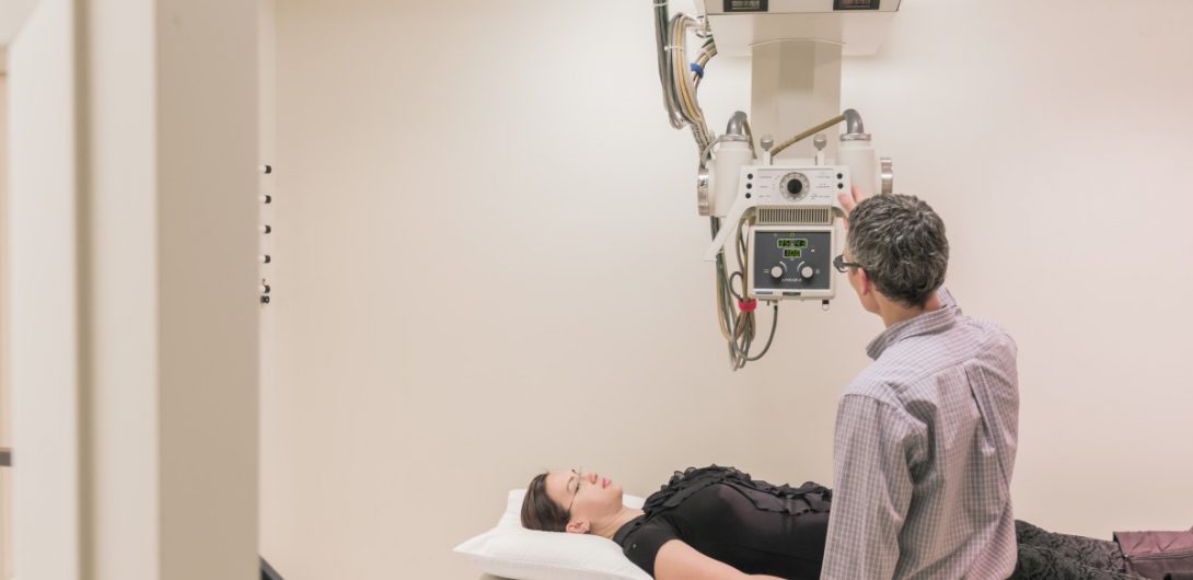a women is diagnoting with xray of information center a women is diagnosed with xray machine