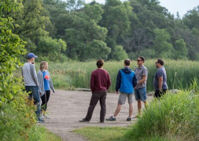 group of people is standing in the wild