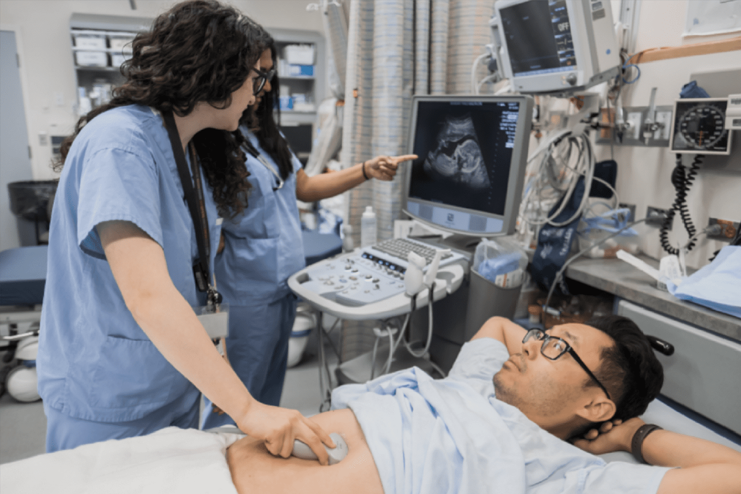 Doctors completing an ultra sound Doctors completing an ultra sound