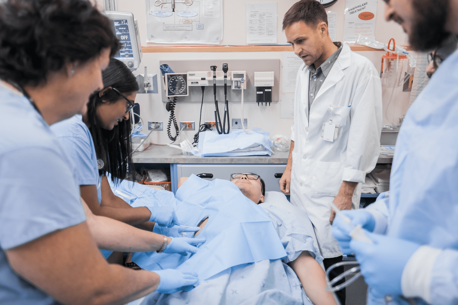 Doctors helping patient in emergency room Doctors helping patient in emergency room